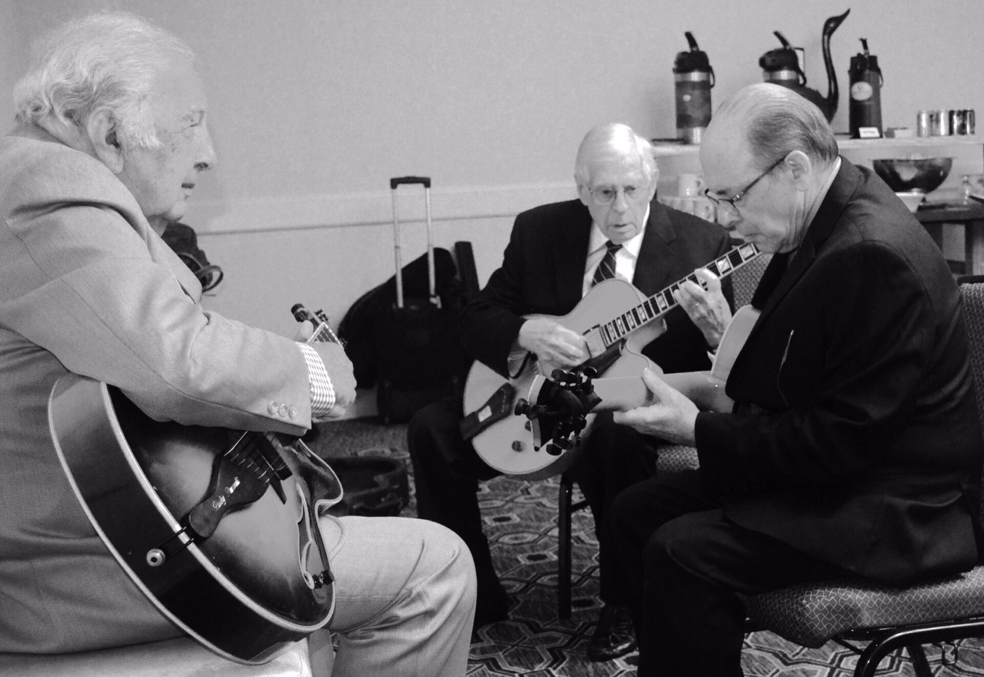 This was taken at the San Diego Jazz Party during one of the best days of my life. 

L to R: Bucky Pizzarelli, Mundell Lowe, Dr. Steve