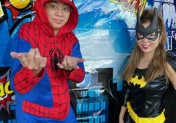 Mr. Huy dressed up s Spiderman at Summer Music Camp for Superhero Day with Ms. Clare.